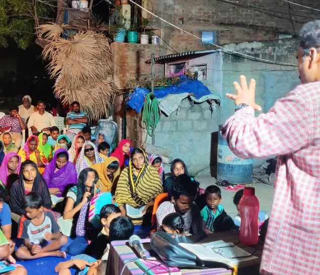 An evening Bible study in a village
